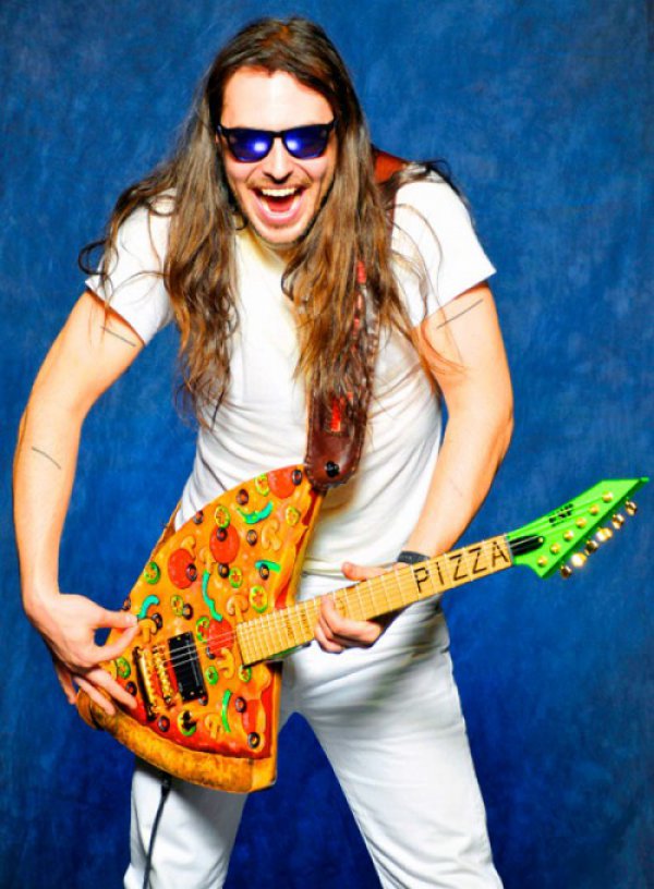 Andrew W.K. playing his pizza guitar. Pizza=love